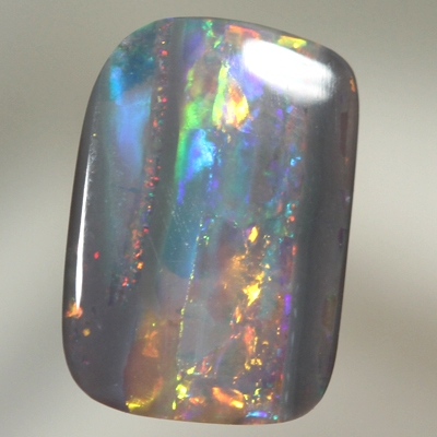 SOLID SEMI BLACK OPAL Fire display showing bands of colour 